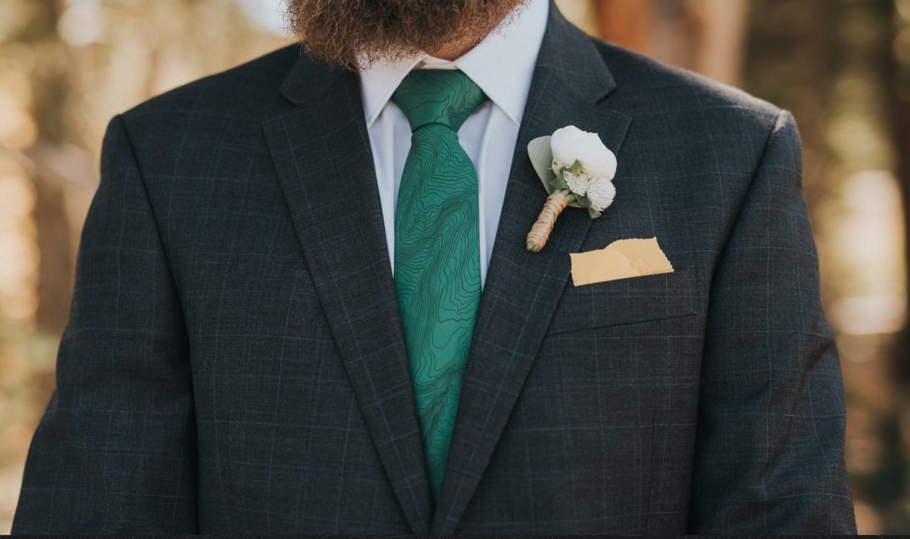 man wearing green topographic tie