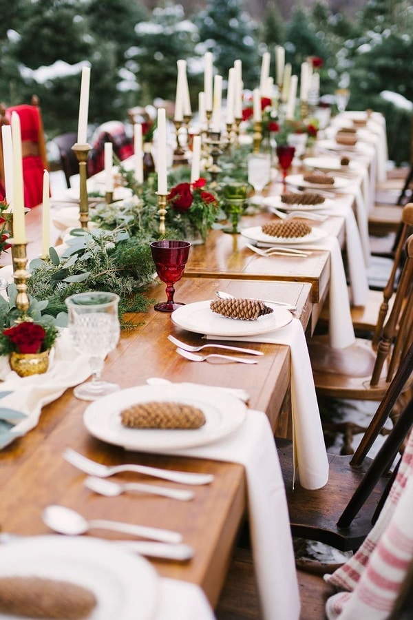 beautiful table sets with pine cones and ruby red pomegranates