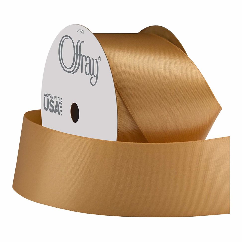 A roll of gold satin ribbon.
