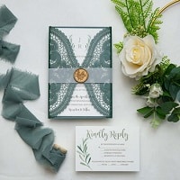 hunter green laser cut wedding invitations with vellum belly band and wax seal ewws307