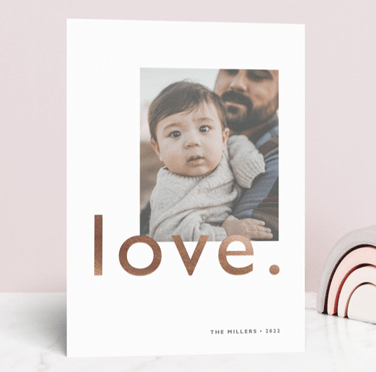 Simple Valentine's Day card with photo of a baby and the word "love" in gold foil