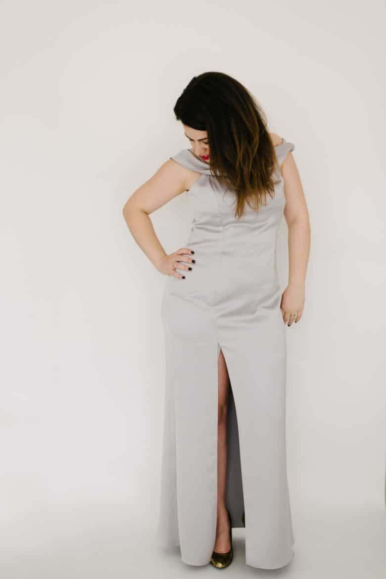 woman in long silver dress with high slit